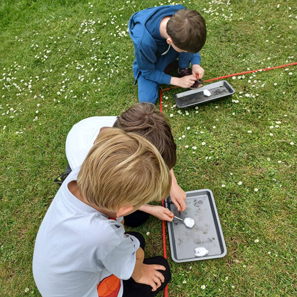 Different ways to light a fire at a primary school bushcraft skills day