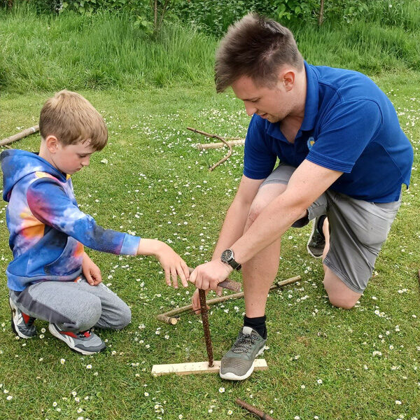 Firelighting skill during a bushcraft day at a primary school