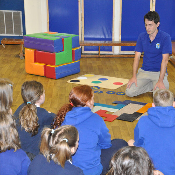 Key Stage 1 pupils taking part in a maths workshop at primary school